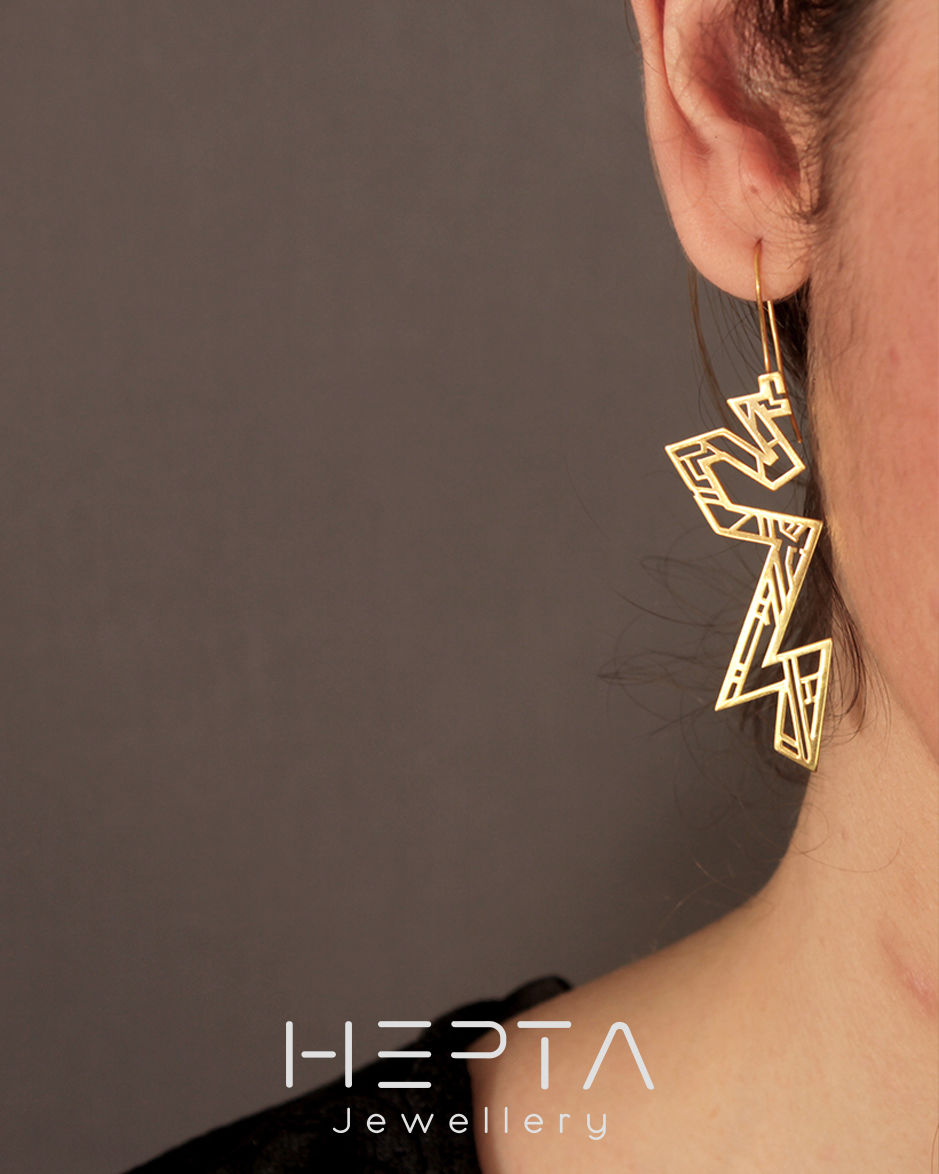 Thumbnail: A model wearing Jewish Museum earrings by Hepta Jewellery and Stefanos Papadatos