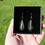 Thumbnail: Small Green Peacock Frond Earrings Topped With White Rooster In Presentation Box