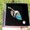Thumbnail: Bullet Casing Hat Pin With Feature Parrot Feather in presentation box.