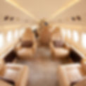 A photograph of a customized interior of a lear jet, in soft neutral colors and with soft diffuse light.
