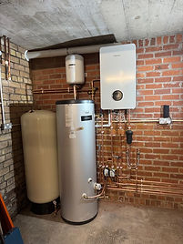 Unvented hot water cylinder, cold water boost tank