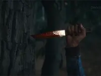 A photo depicting a bloody knife from the Friday the 13th prequel series Crystal Lake