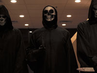 An image of three masked killers from the movie We Can't Leave