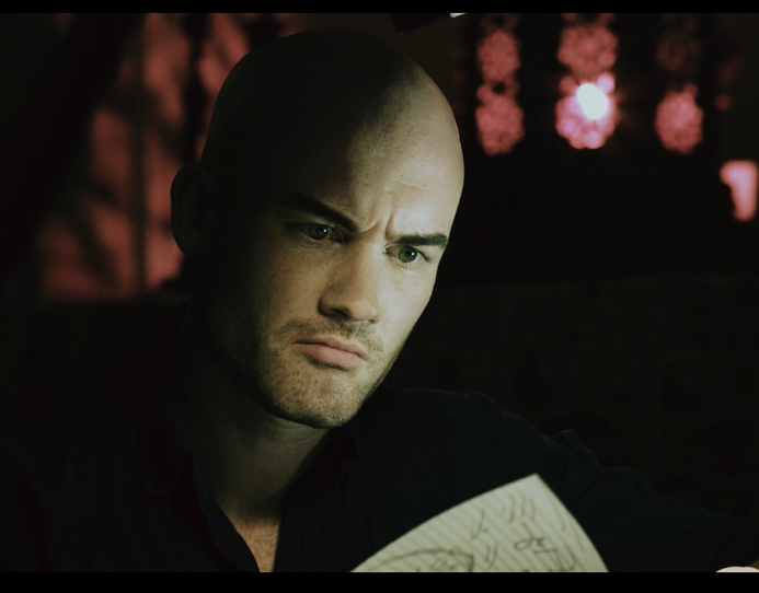 An image of actor James van Langenberg as the character John in the horror movie expecting