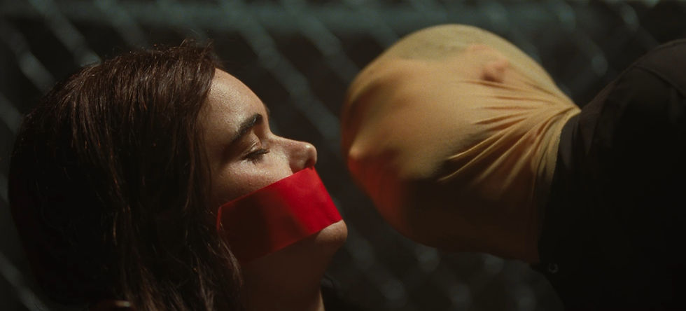 A production still from the Faces of Death remake, featuring Barbie Ferreira as Margot and Dacre Montgomery as Arthur
