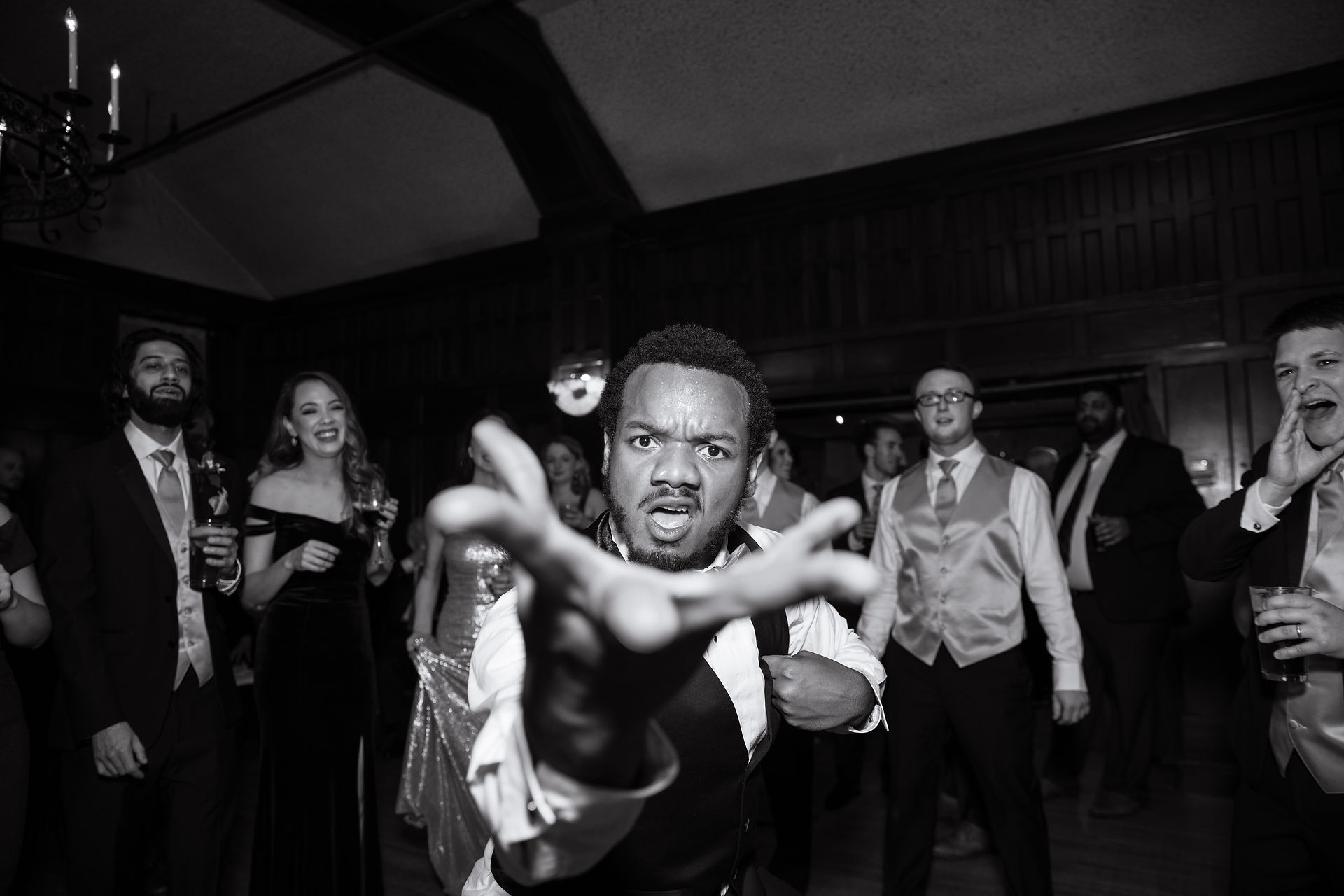 groomsman in front of the camera closely 