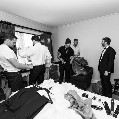 groomsmen all getting ready together