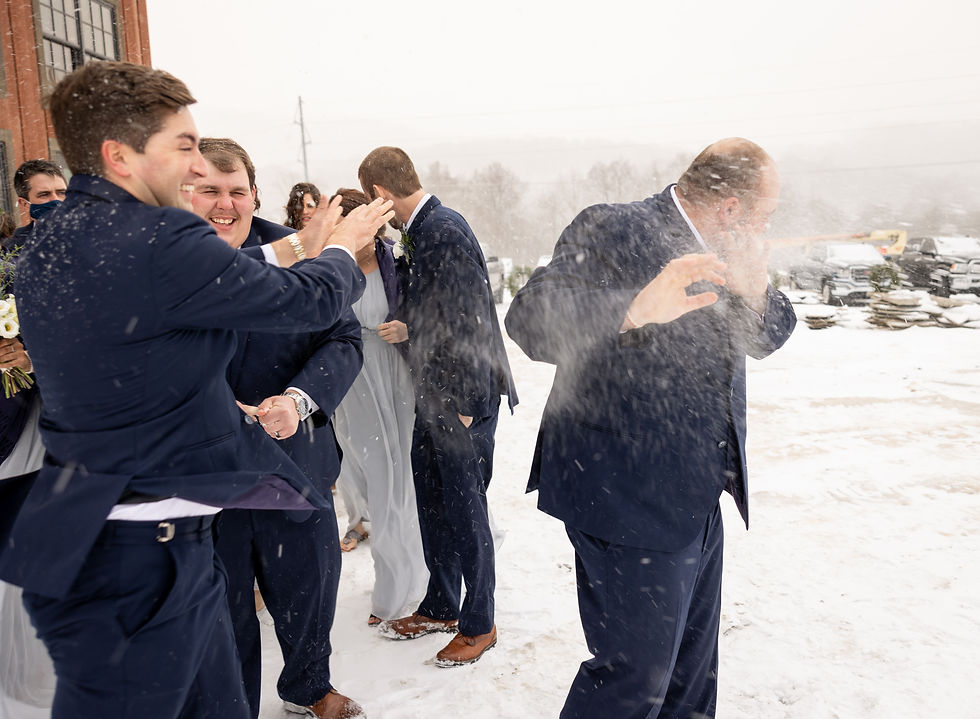 groomsman throwing snow at the groom