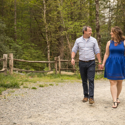 couple smiling at each other as they hold hands