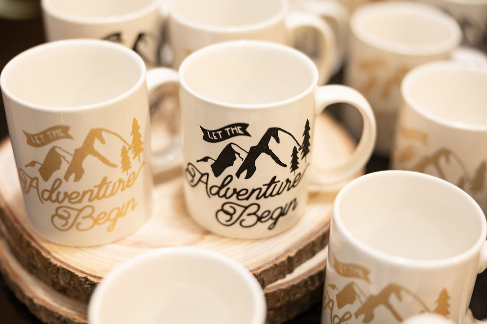 Wedding Party favors that are custom coffee mugs with different sayings on them about adventures beginning.