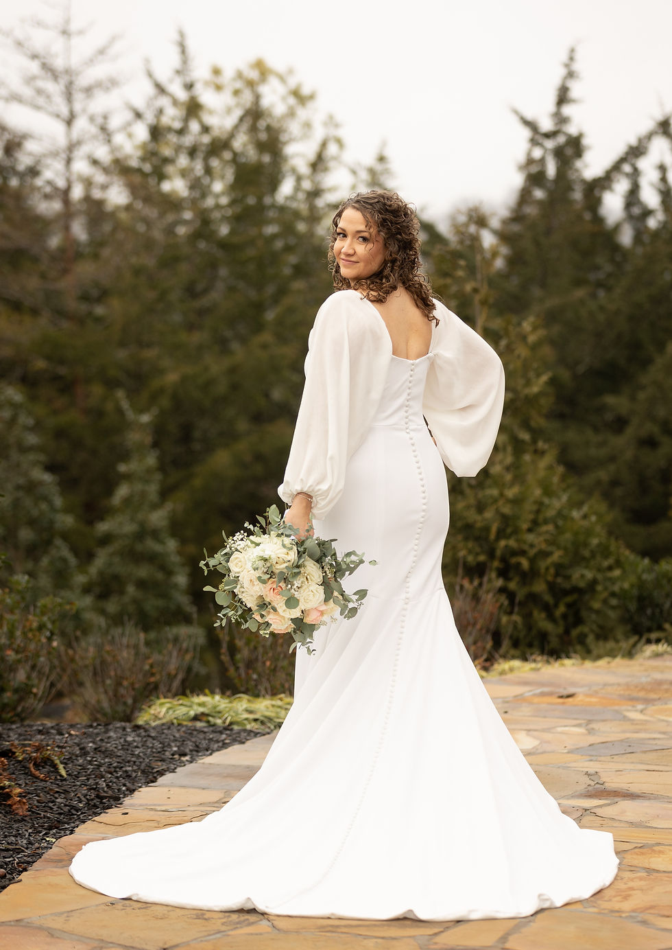 Bridal portrait showing off the back of the dress.
