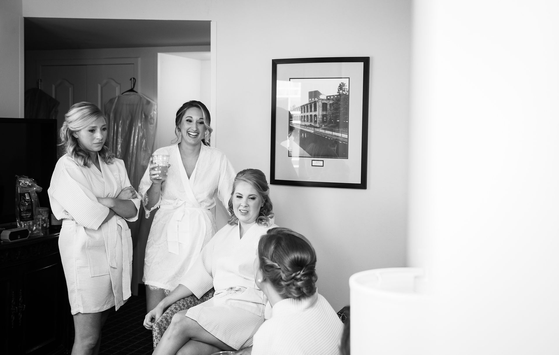 candid of bride and bridesmaids talking 