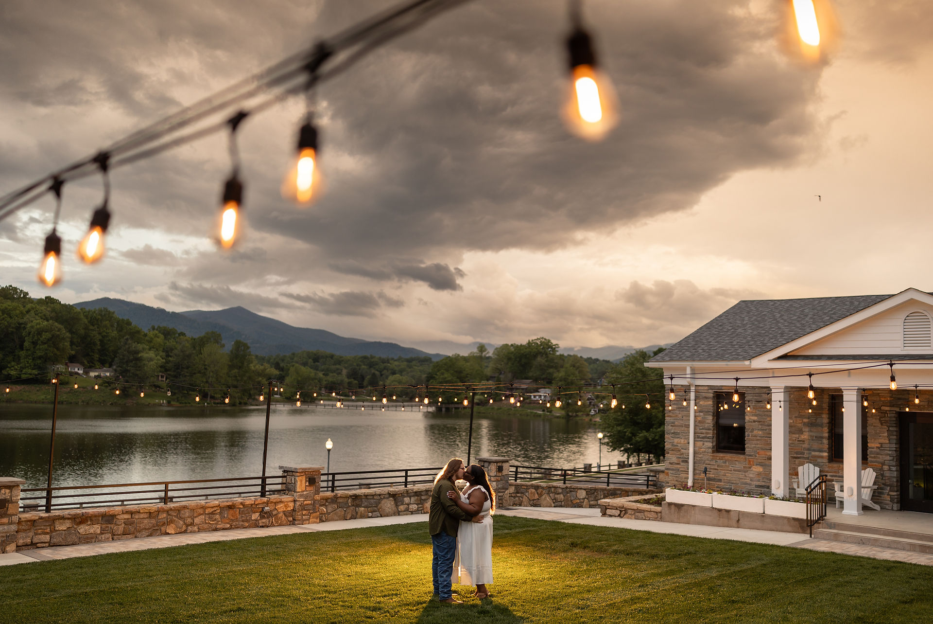 A creative lighting portrait of a couple of kissing at Lake Junaluska.