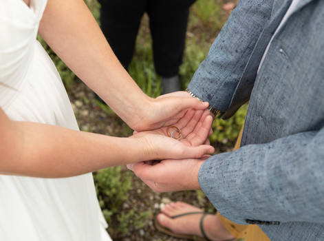 bride and grooms hands during the wedding ceremony