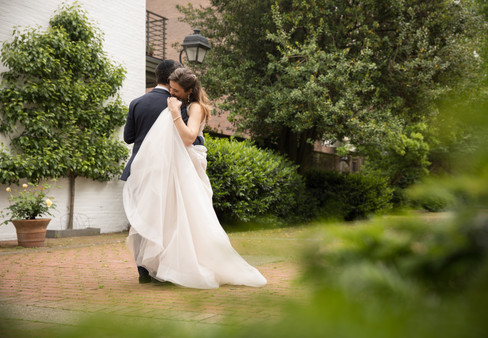 groom hugging bride