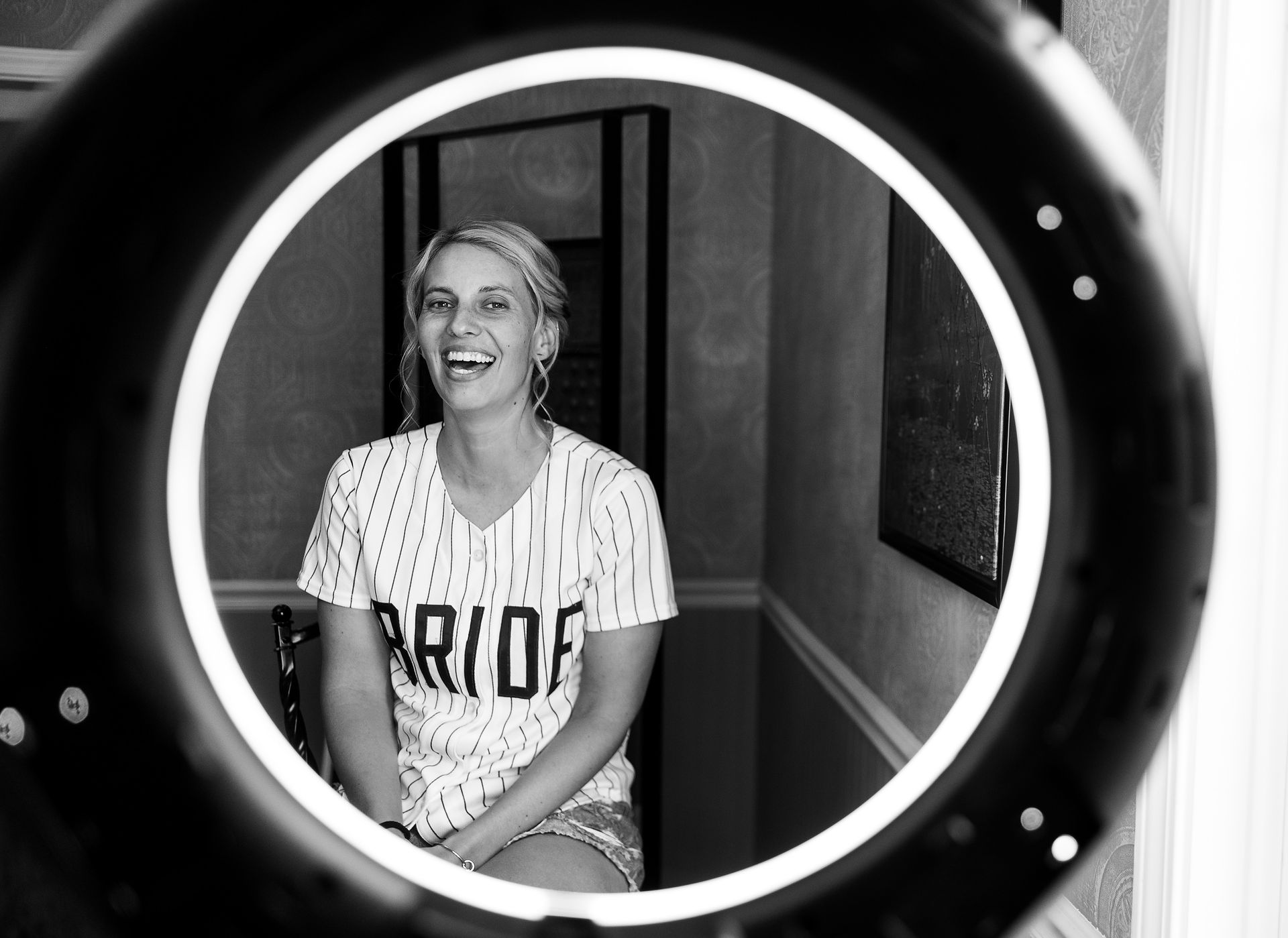 portrait of the bride laughing through a ring light 