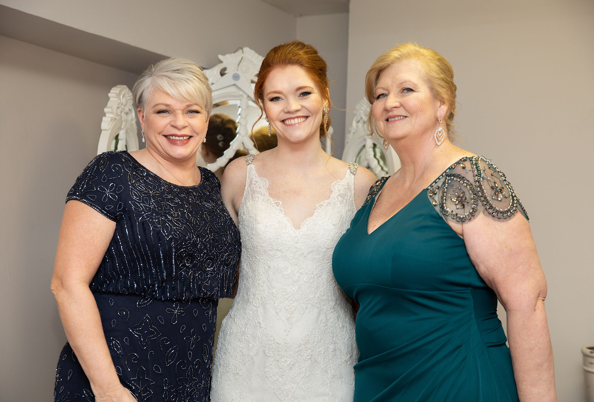 bride taking a photo with her family 
