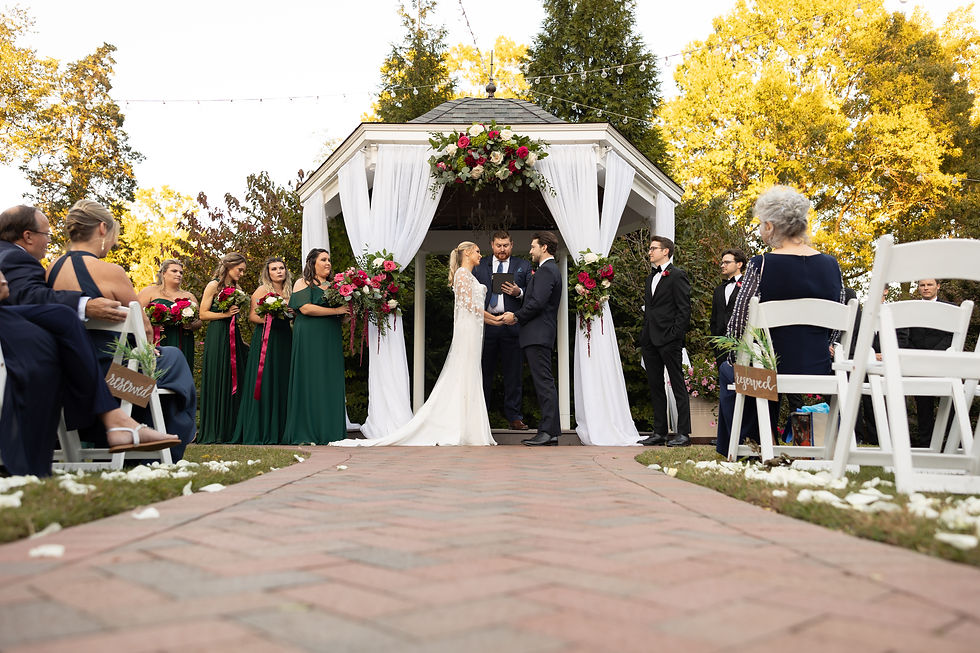 wedding ceremony shot of bride and groom holding hands
