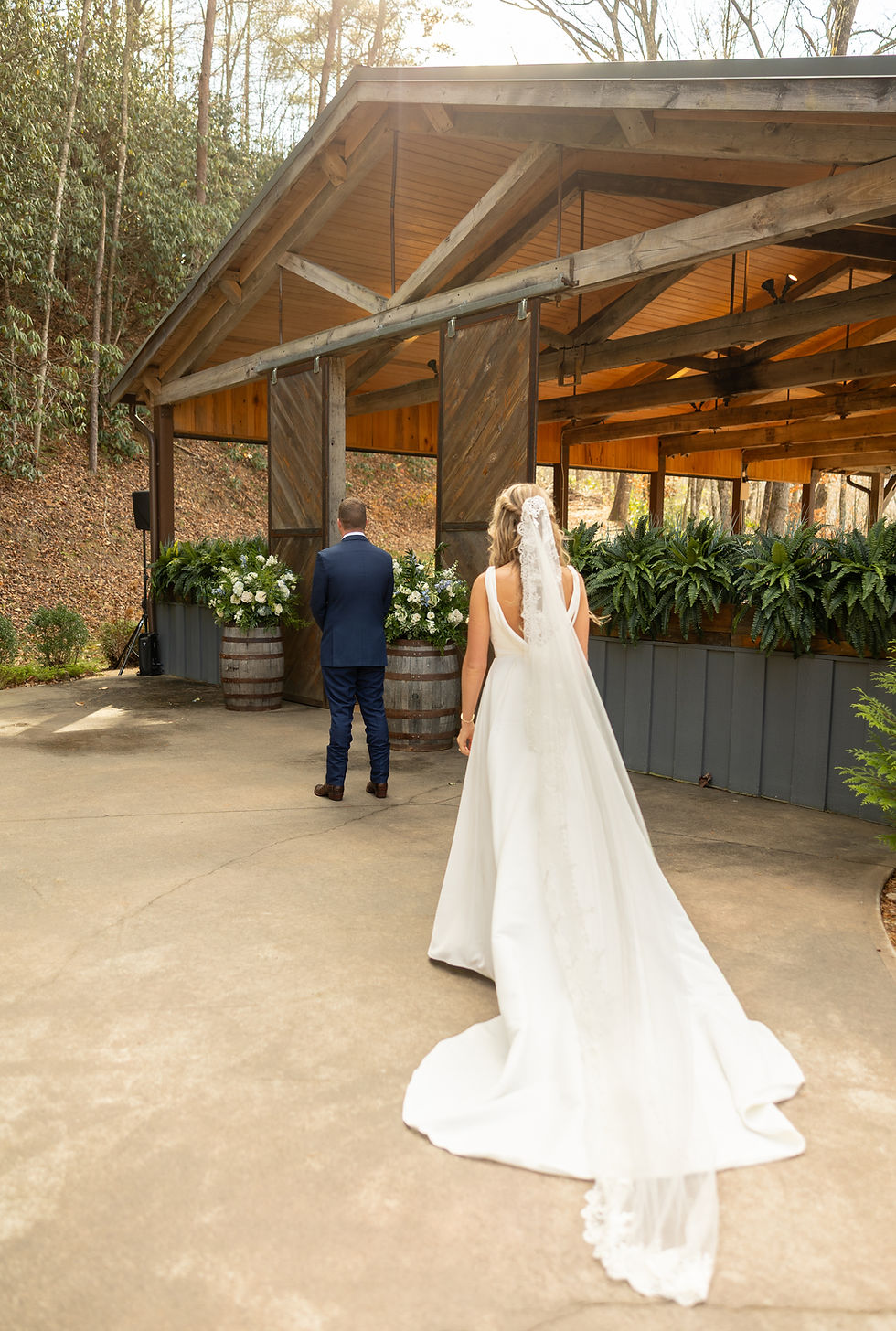 The bride approaching the groom from behind for the first look.