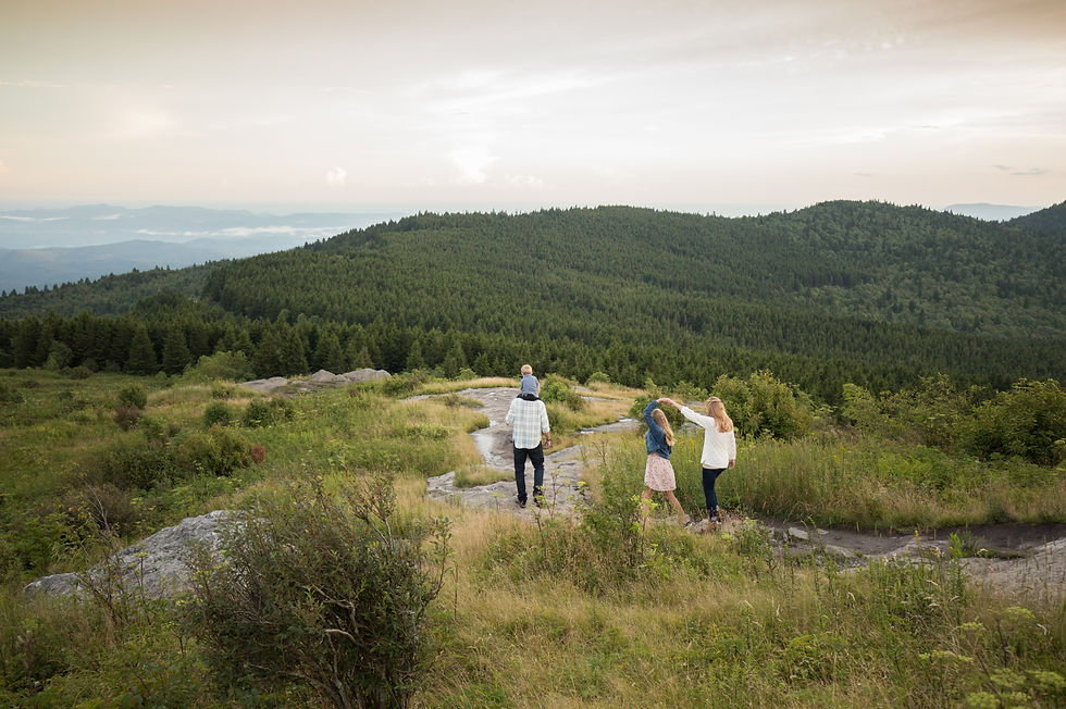 family walking through the mountains together