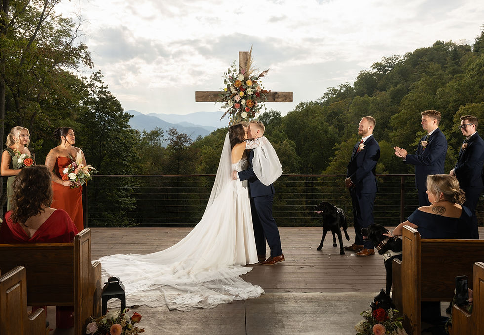 The bride and groom sharing their first kiss.