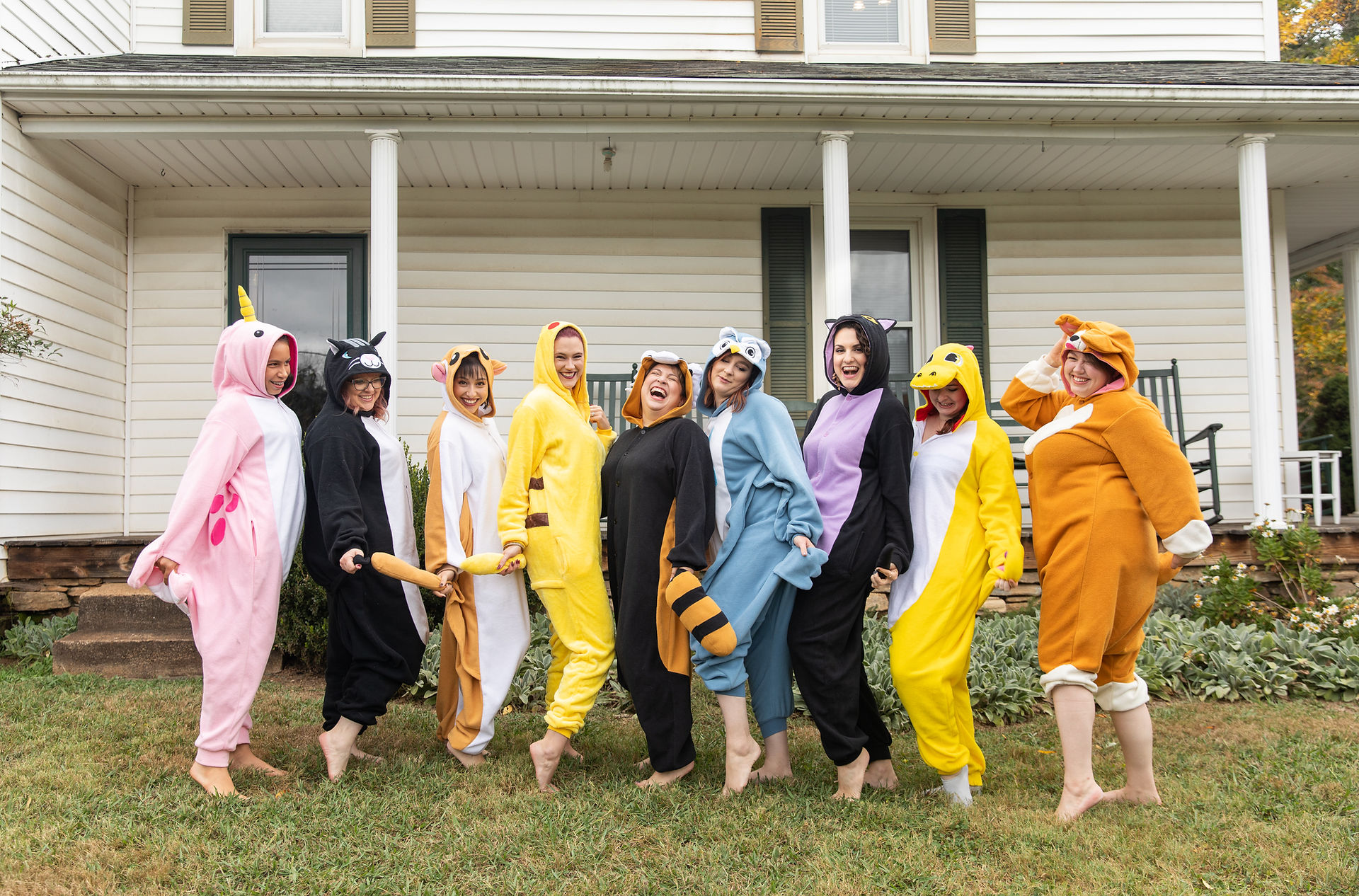 fun bridal party portrait of the bridal party wearing animal outfits 