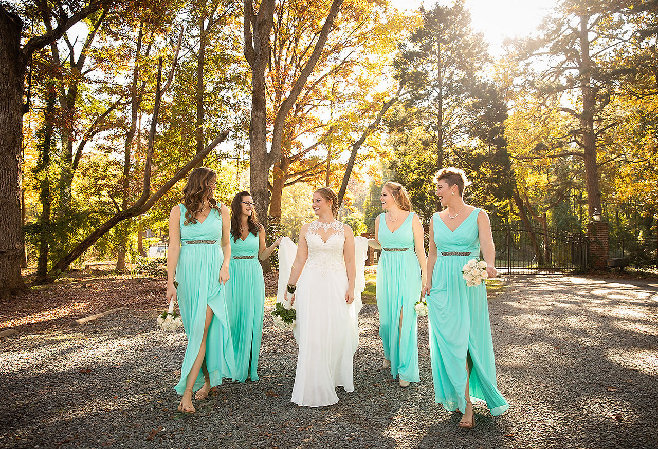 bride walking with her bridesmaids 