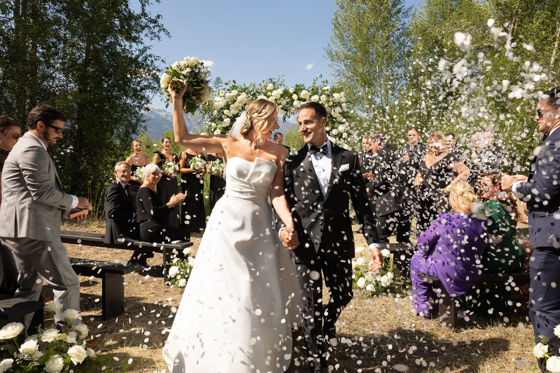 bride and groom leaving during their recessional 