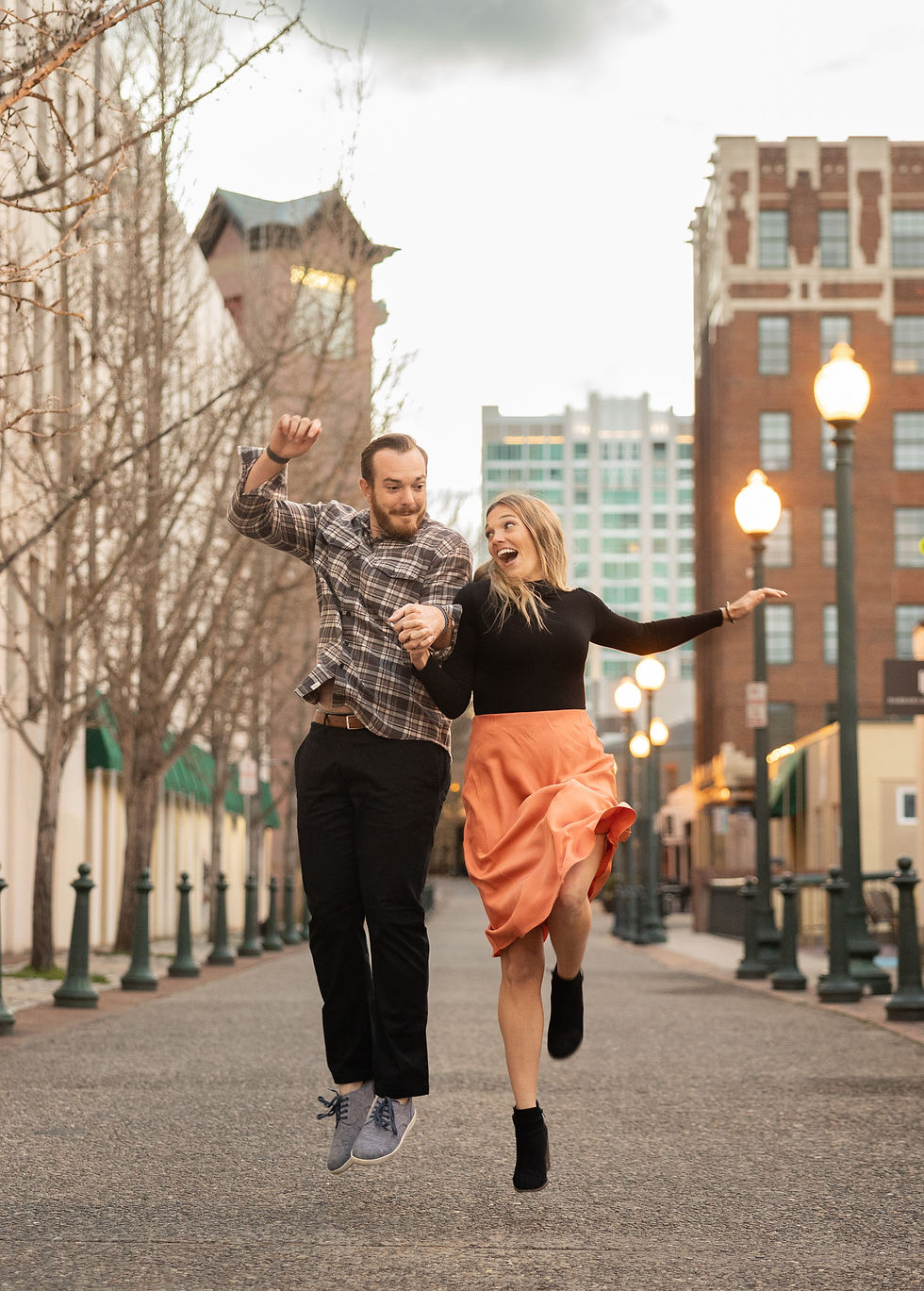 a couple doing a jumping hip check