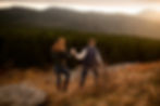 engaged couple holding hands and hiking at black balsam knob