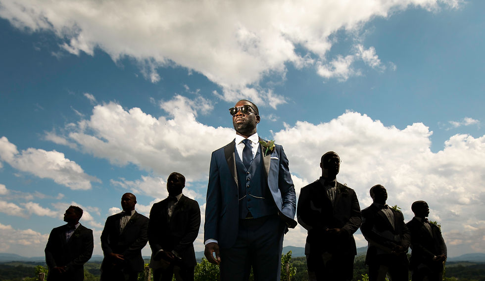 creative lighting portrait of the groom with the groomsmen