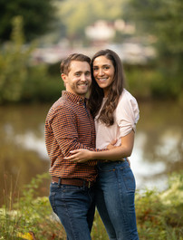 Traditional portrait of a couple smiling.