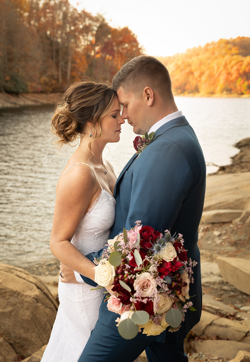 bride and groom resting foreheads on each other