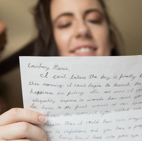 bride reading a note from the groom