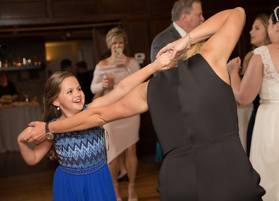 little girl dancing with her mother
