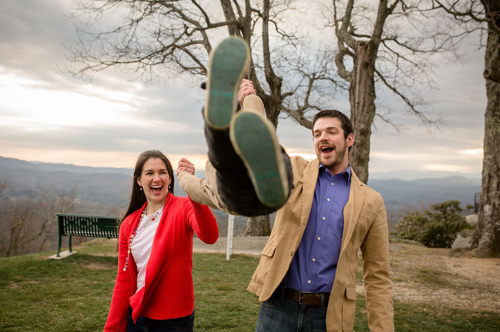 mom and dad swinging their child in the air