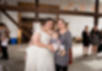bride taking a photo with her friend 
