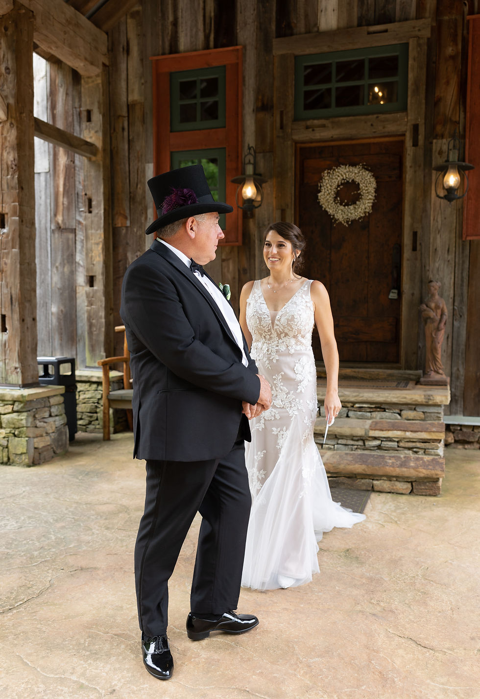 the bride and her father seeing each other for the first time in her dress