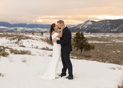 A bride and groom kissing during their winter elopement in Jackson Hole.