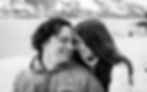 engaged couple resting foreheads on each other