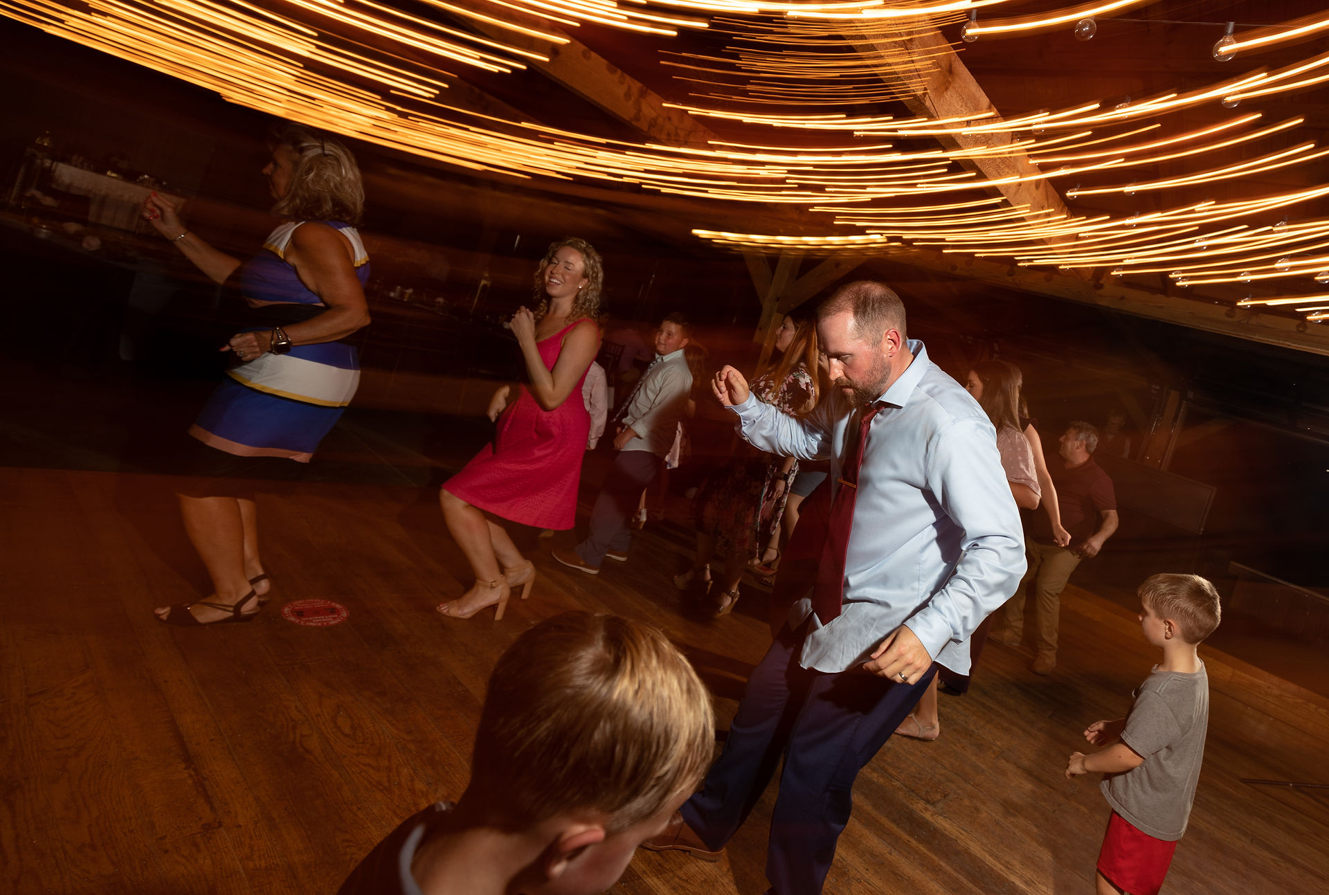 groom dancing with kids