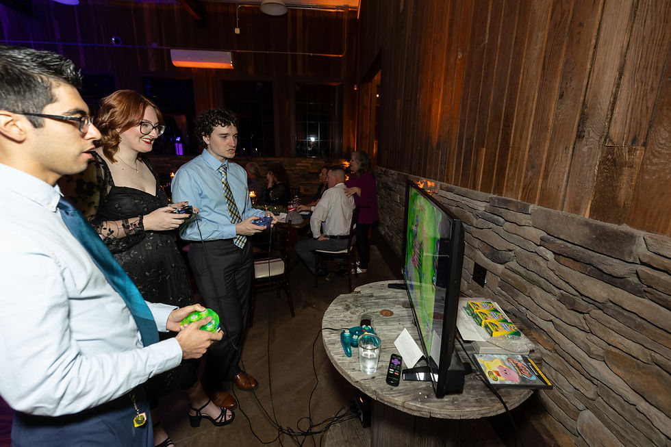 Wedding guests playing video games.