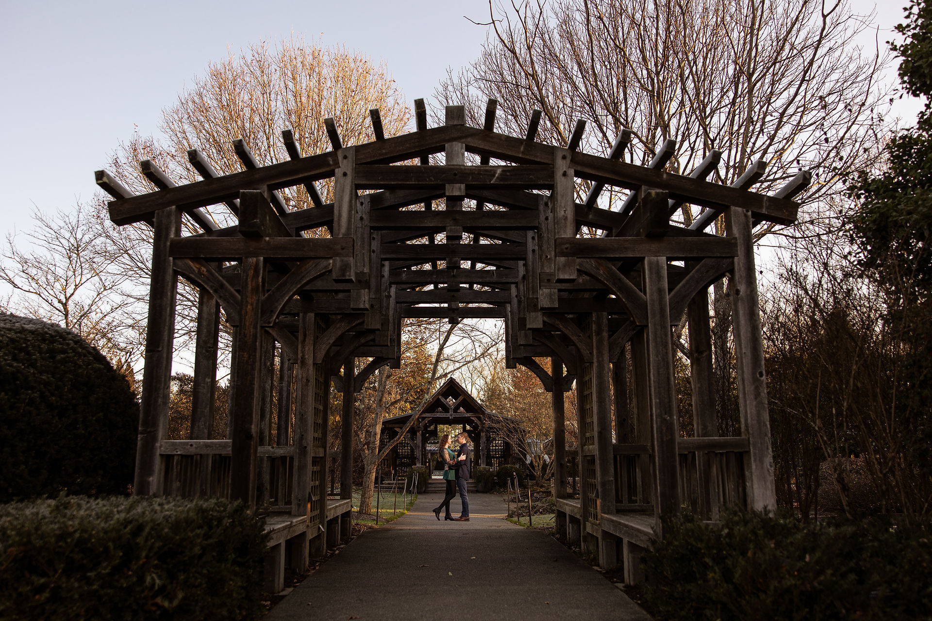 Creative framing shot of a couple kissing.