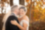groom kissing bride underneath her veil