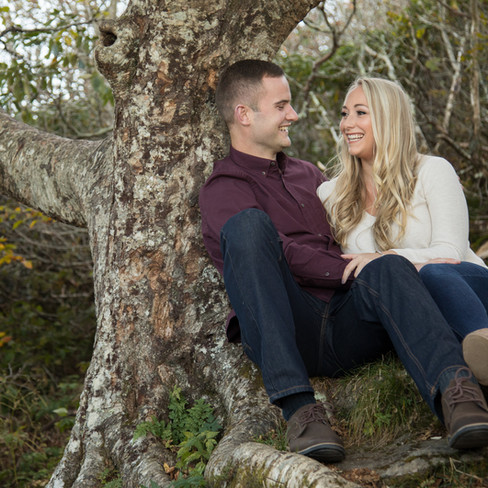 engaged couple sitting together 