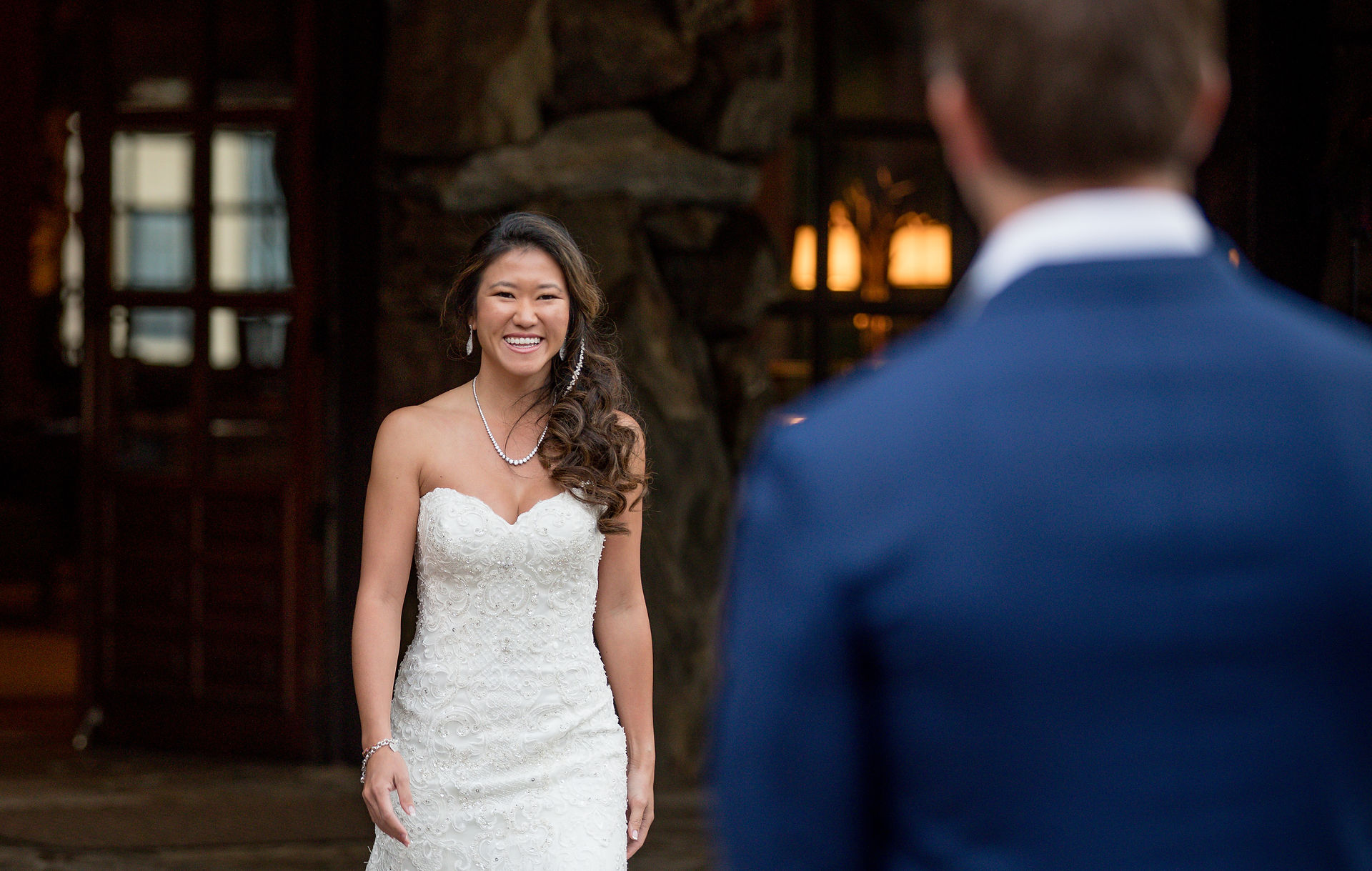 bride smiling at the groom 