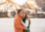 traditional portrait of a couple smiling in front of Jenny Lake