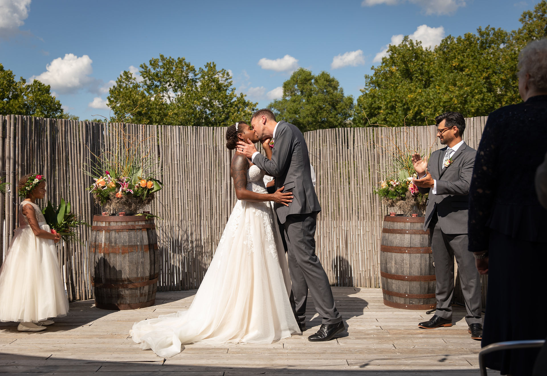 bride and groom sharing their first kiss 