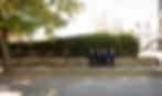 groom and groomsmen hanging out in front of the venue