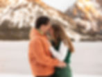 a couple holding each other and laughing together